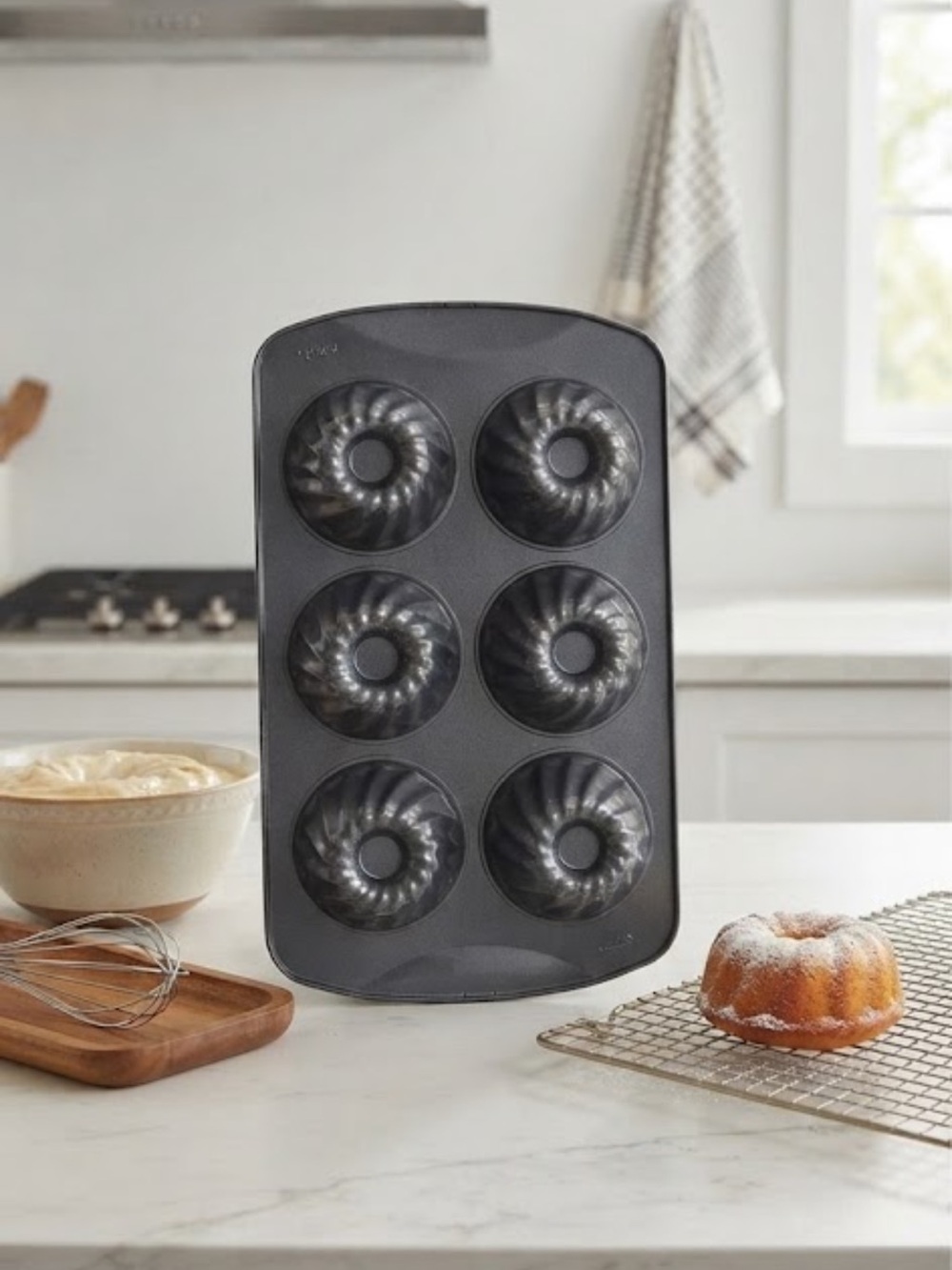 6-cavity non-stick mini fluted tube cake or bundt pan.